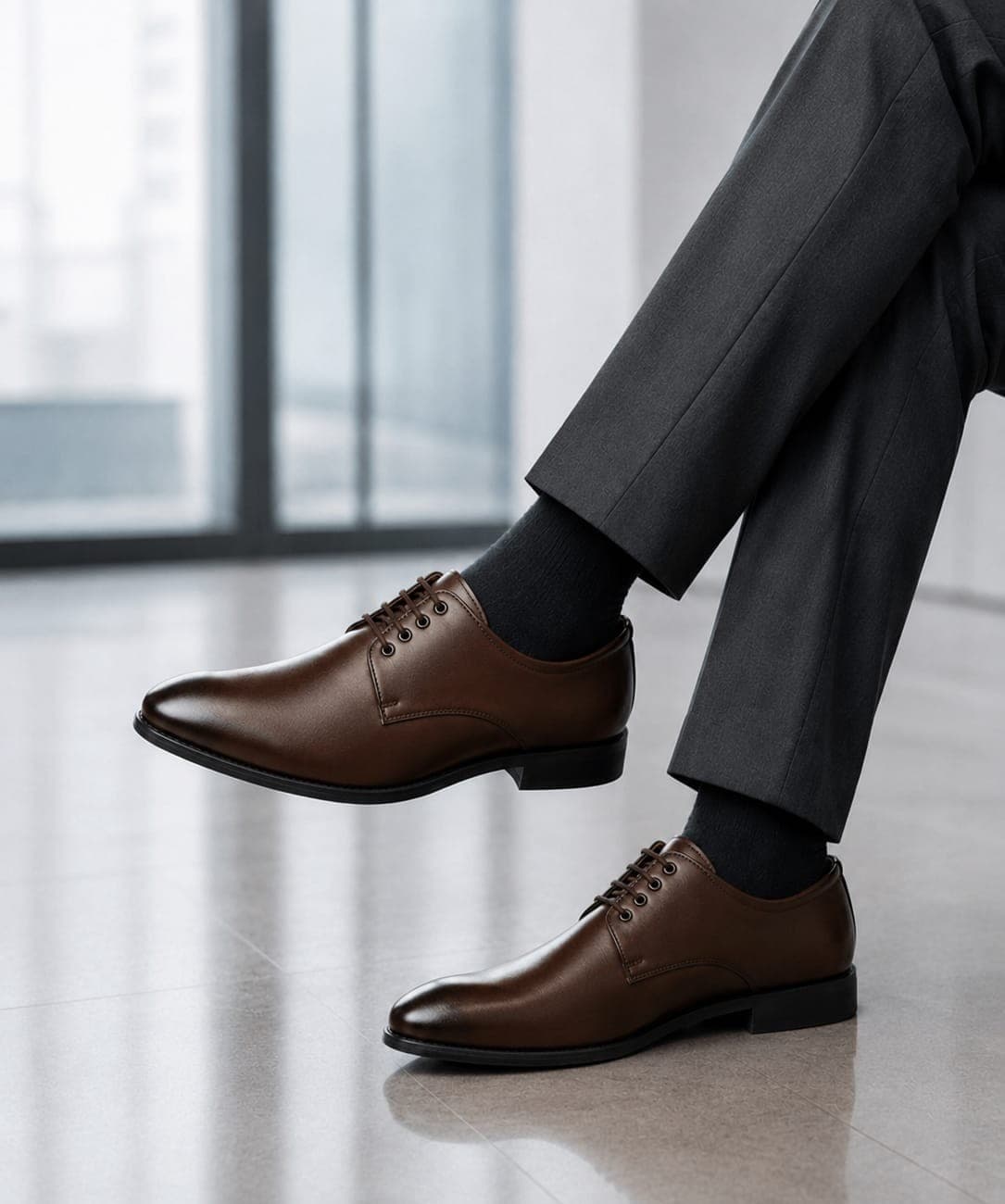 Vayron Premium in brown, worn with grey trousers in an office
